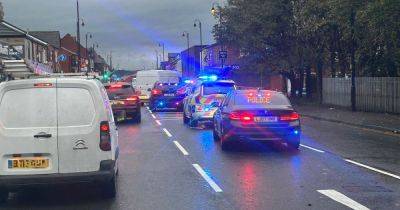 Main road taped off after boy, 16, hit by police vehicle in serious crash - updates
