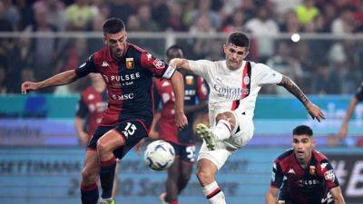 Milan go top with late Pulisic strike at Genoa as Giroud ends up in goal