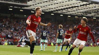 Neal Maupay - Harry Maguire - Red Devils - Jonny Evans - Mathias Jensen - Christian Norgaard - Andre Onana - McTominay late late spares Man United blushes - channelnewsasia.com - Scotland