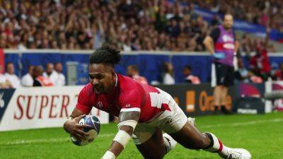 Seven-try Tonga bow out with World Cup win over Romania