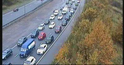 Part of M60 closed following crash between car and motorbike