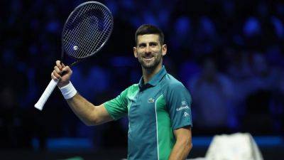 Novak Djokovic wins his ATP Finals opener to lock in world number one spot