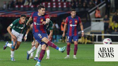 Lewandowski double rescues Barca, Atletico beat Villarreal