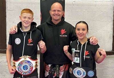 Margate-based The Falcons Kickboxing Club celebrating world junior titles from Hero of the Hall show for Aston Young and Cleo Musslewhite