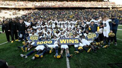 Michigan becomes first program to win 1,000 games, remains undefeated as Jim Harbaugh's ban continues