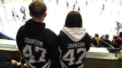 Adam Johnson's team retires his number in return to ice for memorial game