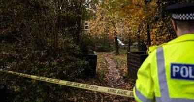 Search underway on wasteland with path taped off as part of 'ongoing police investigation'