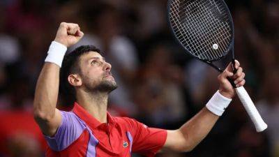 Djokovic battles back to advance to Paris quarter-finals