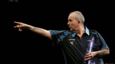 Darts-Phil 'The Power' Taylor to retire at end of 2024 - channelnewsasia.com