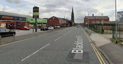 Police cordon off main road after woman hit by car