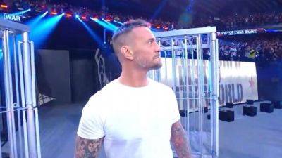 CM Punk returns to WWE in surprise appearance at Survivor Series - ESPN