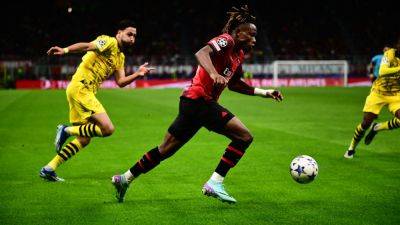 Dortmund see off Milan to reach Champions League knockouts
