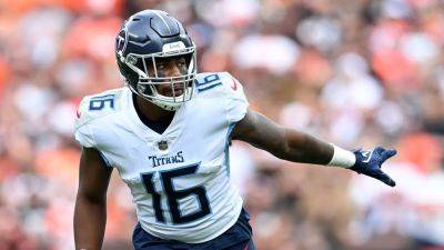 Titans' Treylon Burks carted off field after hitting head on field, laying motionless