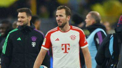 Harry Kane - Leroy Sané - Kane hat-trick fires Bayern to 4-0 win at Dortmund - channelnewsasia.com - Germany - county Kane
