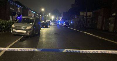 LIVE: Man 'shot and stabbed' as Greater Manchester Police close off road - latest updates