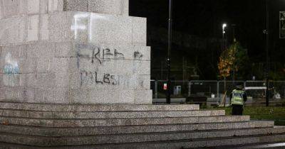 LIVE: Police guard in place around Greater Manchester war memorial after 'free Palestine' graffitied on it - updates