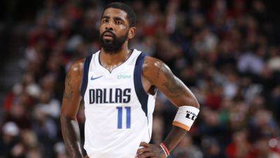 Mavericks star Kyrie Irving out with right heel contusion - ESPN