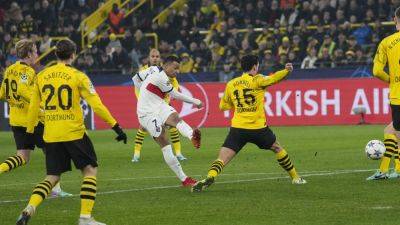 PSG snatch Champions League last-16 spot despite draw at Dortmund