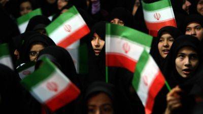 Female soccer fans in Iran allowed into Tehran stadium for men's game. FIFA head praises progress