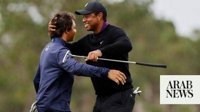 Tiger makes pro-am walk ahead of title hunt with son Charlie