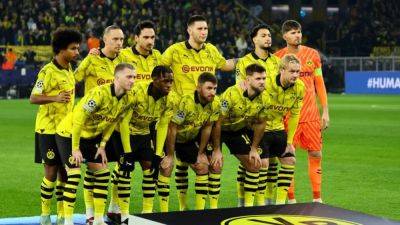 Dortmund slip up again with 1-1 draw at Augsburg to stay fifth