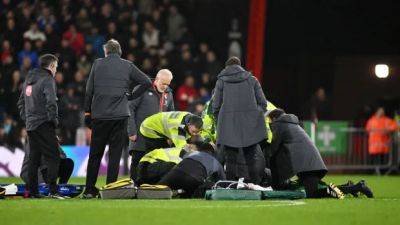 Player responsive after suffering cardiac arrest during Premier League match, game abandoned