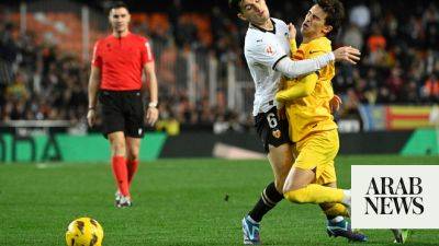 Barcelona held at Valencia for third game without a win. Sevilla fire coach Diego Alonso