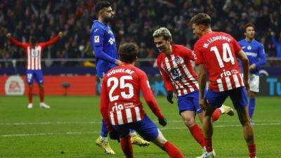 Getafe hold 10-man Atletico Madrid to 3-3 draw as Griezmann equals club record