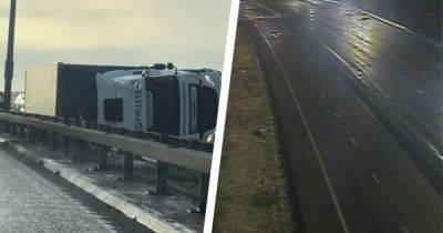M60 shut for 12 HOURS after lorry overturns near Trafford Centre in Storm Pia winds with emergency services at scene all day