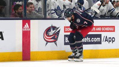 Blue Jackets' Sean Kuraly collapses behind team bench after hit in scary scene