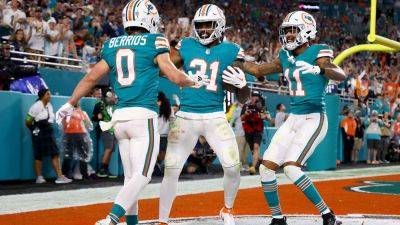 Dolphins splash into playoffs with thrilling win over Cowboys