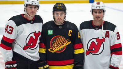 All 3 Hughes brothers play in same game as Devils top Canucks - ESPN