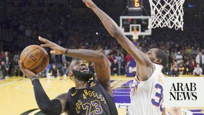 James and Lakers down Suns while Bucks romp past Knicks