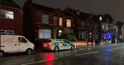 Murder investigation launched and two people arrested after man found dead in Salford house