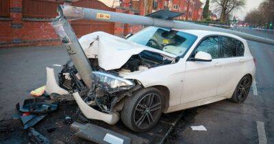 BMW crushed by street light as police hunt driver after smash - manchestereveningnews.co.uk - Manchester