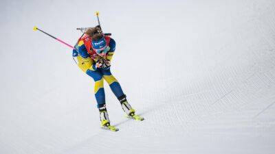 Hanna Oeberg fights back to claim individual biathlon world title ahead of compatriot Linn Persson