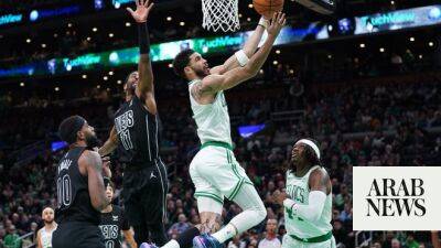 Tatum leads Celtic rout of Nets, Sixers bounce back against Magic