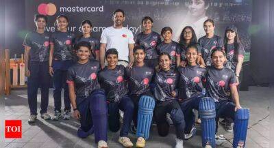 MS Dhoni mentors U-19 women players at a cricket clinic in Mumbai