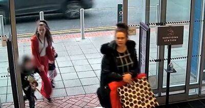 Police release images of two women they want to speak to entering a shop in Manchester