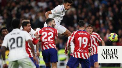 Real Madrid score late to draw with 10-man Atletico