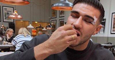 Tommy Fury celebrates his Jake Paul win with a GIANT burger at fave market hall