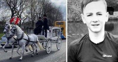 Teenager's funeral brings town to a standstill as hundreds of mourners gather at football ground