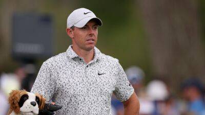 Rory McIlroy faces battle to make cut at weather-hit Players Championship, Jon Rahm withdraws due to illness