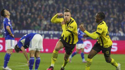 Schalke lifted off the bottom of Bundesliga as Borussia Dortmund stumble in title chase with Bayern