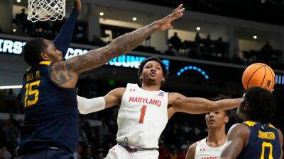 Maryland overcomes slow start to bounce West Virginia from March Madness
