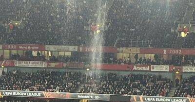 Arsenal fans left soaked by malfunctioning Emirates roof and are forced to move during Sporting Europa League clash