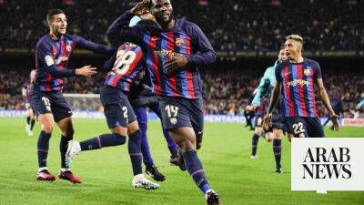 Barcelona rally to top Madrid, move closer to league title
