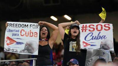 Anti-Communist protests take center stage during World Baseball Classic between US and Cuba
