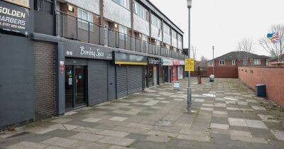 Police scrambled after reports of stabbing outside row of shops