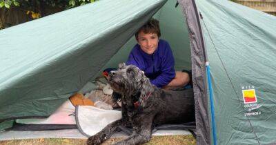 Boy who spent THREE YEARS camping in garden sets Guinness world record